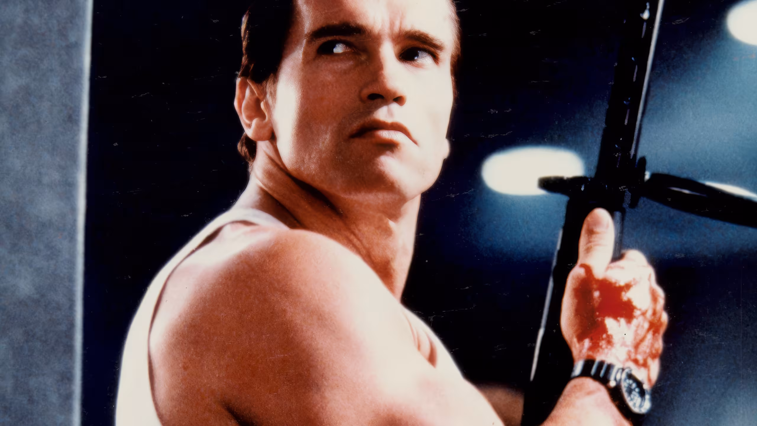 Arnold Schwarzenegger wearing Seiko H558-5000 in Raw Deal