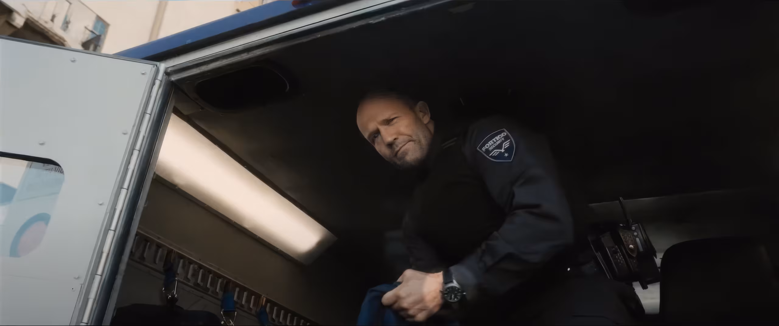 Jason Statham wearing IWC Pilot's Watches Double Chronograph Top Gun Ceratanium in Wrath of Man