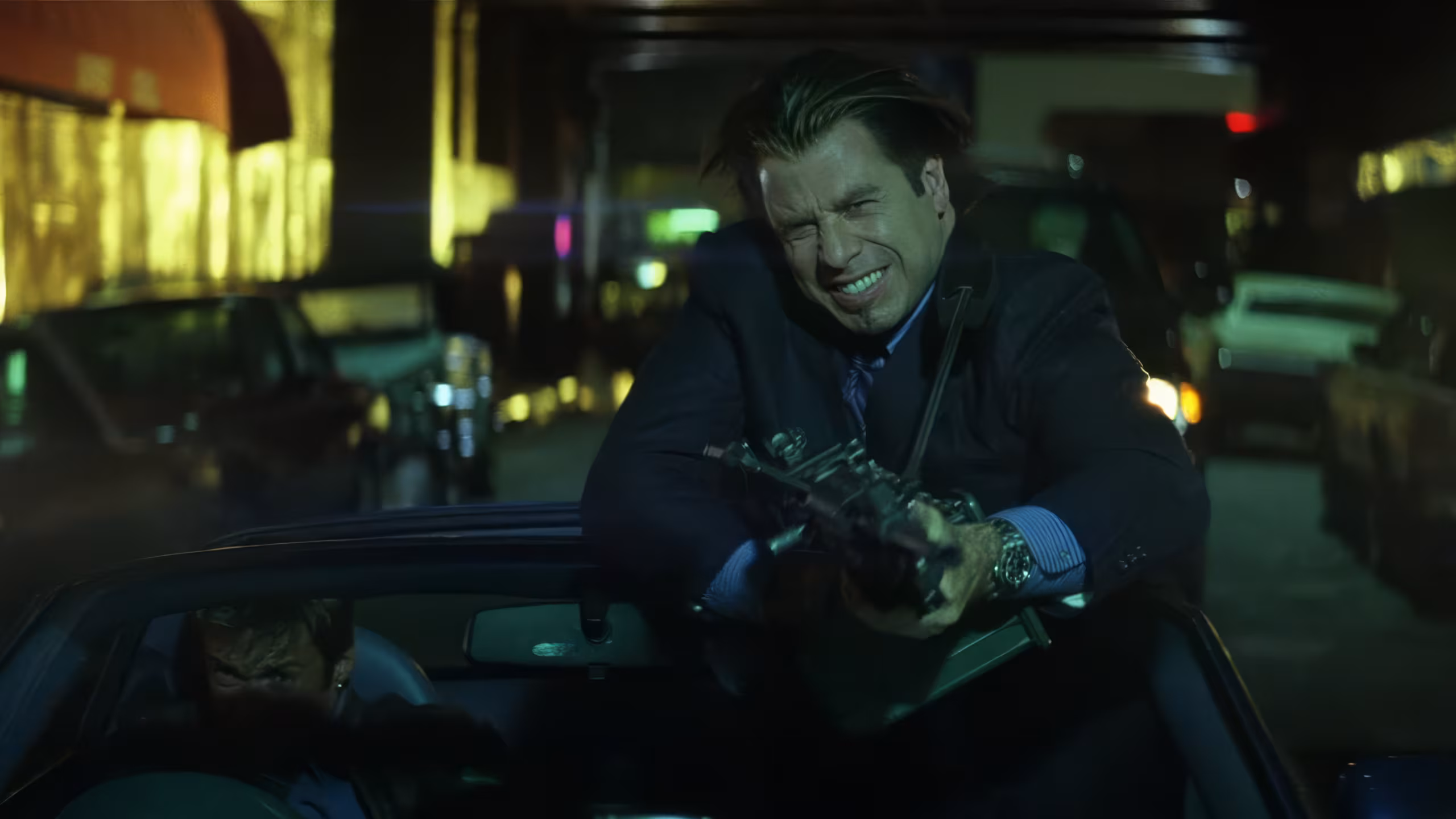 John Travolta wearing Rolex Submariner Yellow Gold in Swordfish