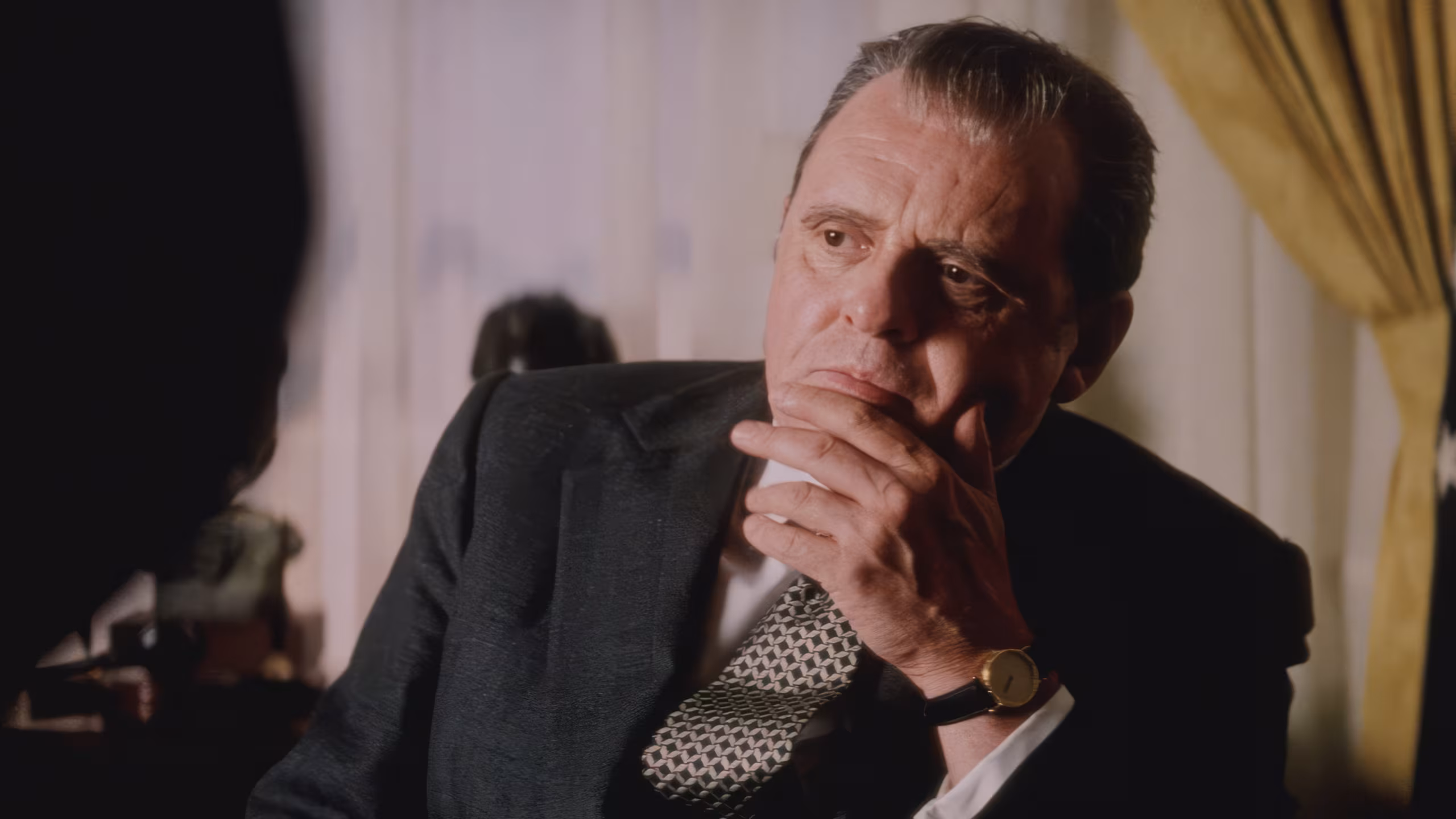 Anthony Hopkins wearing Corum Double Eagle Coin Watch in Nixon