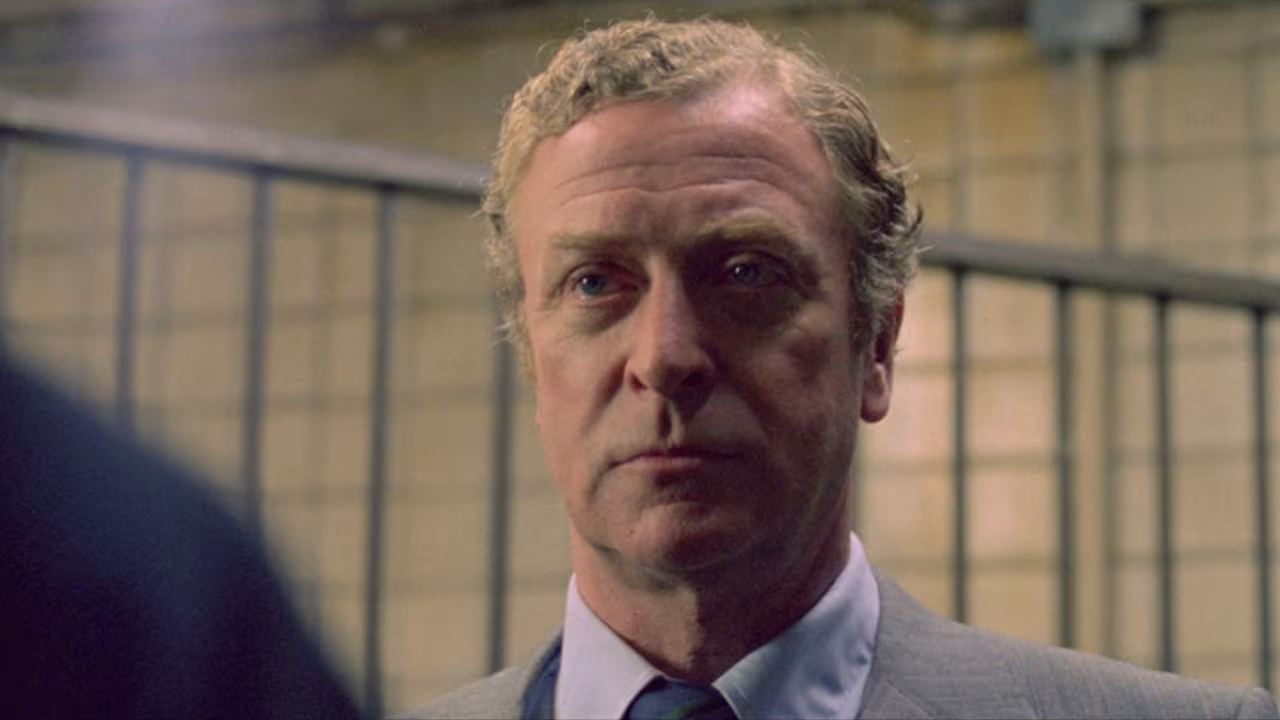 Michael Caine wearing Rolex Day-Date in A Shock to the System