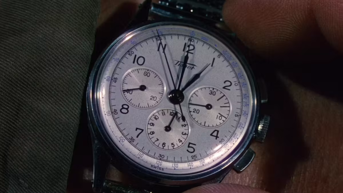 Alec Guinness wearing Tissot Chronograph in The Ladykillers