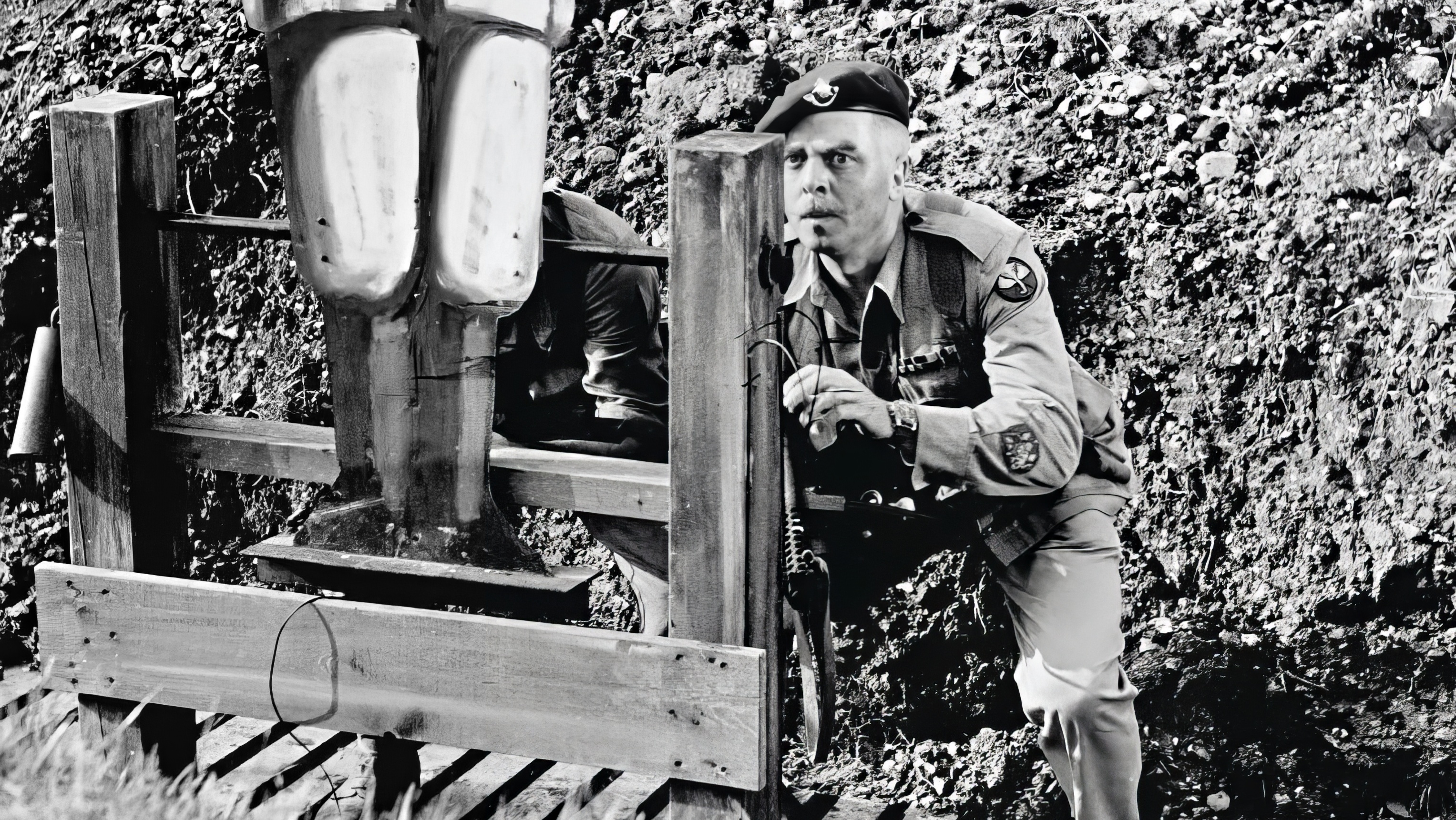 Richard Attenborough wearing Omega Speedmaster in Guns at Batasi