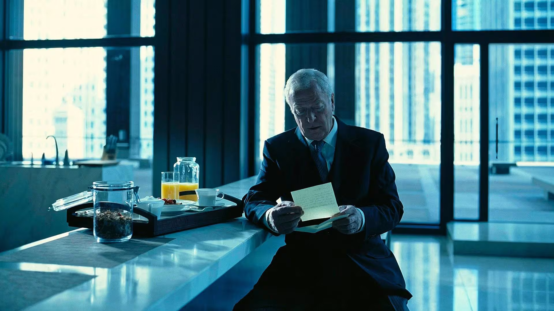 Michael Caine wearing Traser Black Storm Pro in The Dark Knight