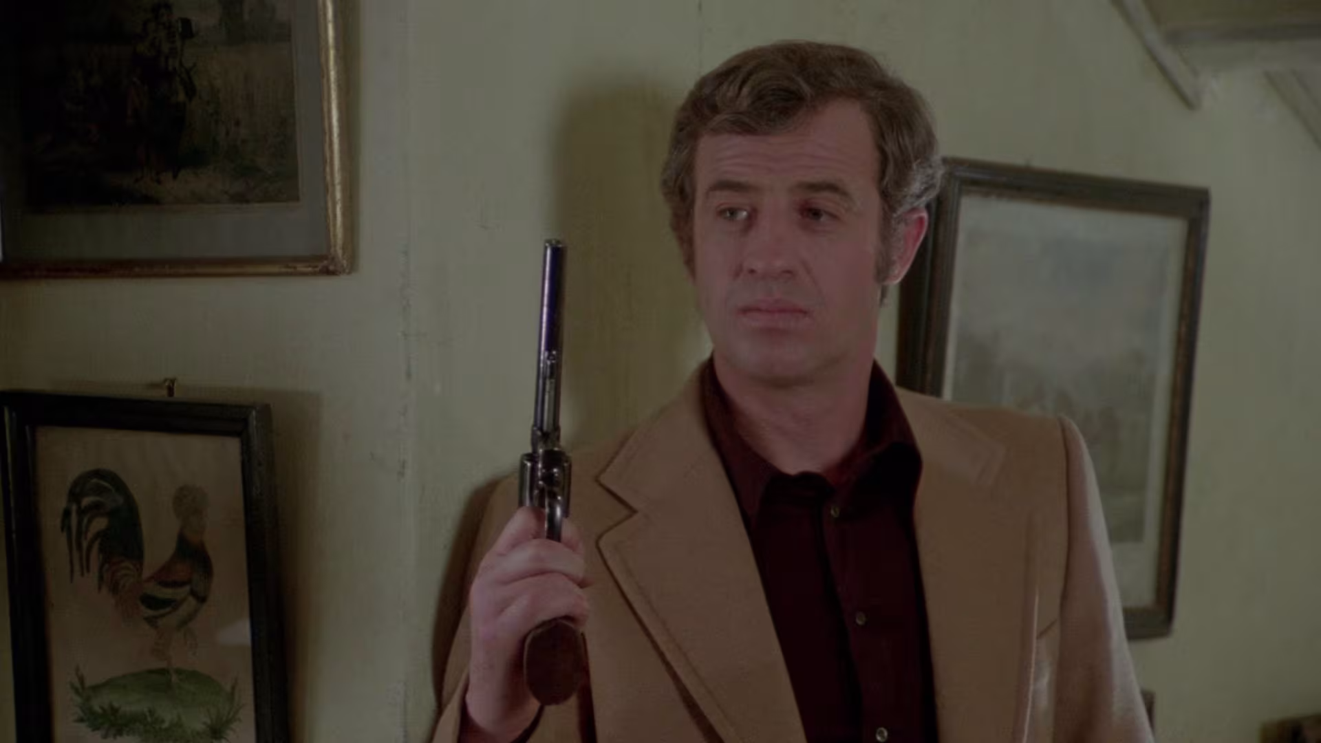 Jean-Paul Belmondo wearing Rolex Cosmograph Daytona Big Red in Hunter Will Get You (L'Alpagueur)