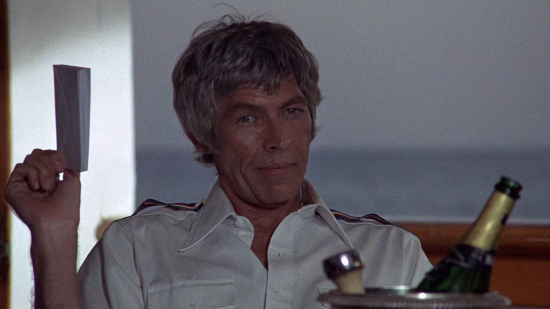 James Coburn wearing Omega Speedmaster in The Last of Sheila