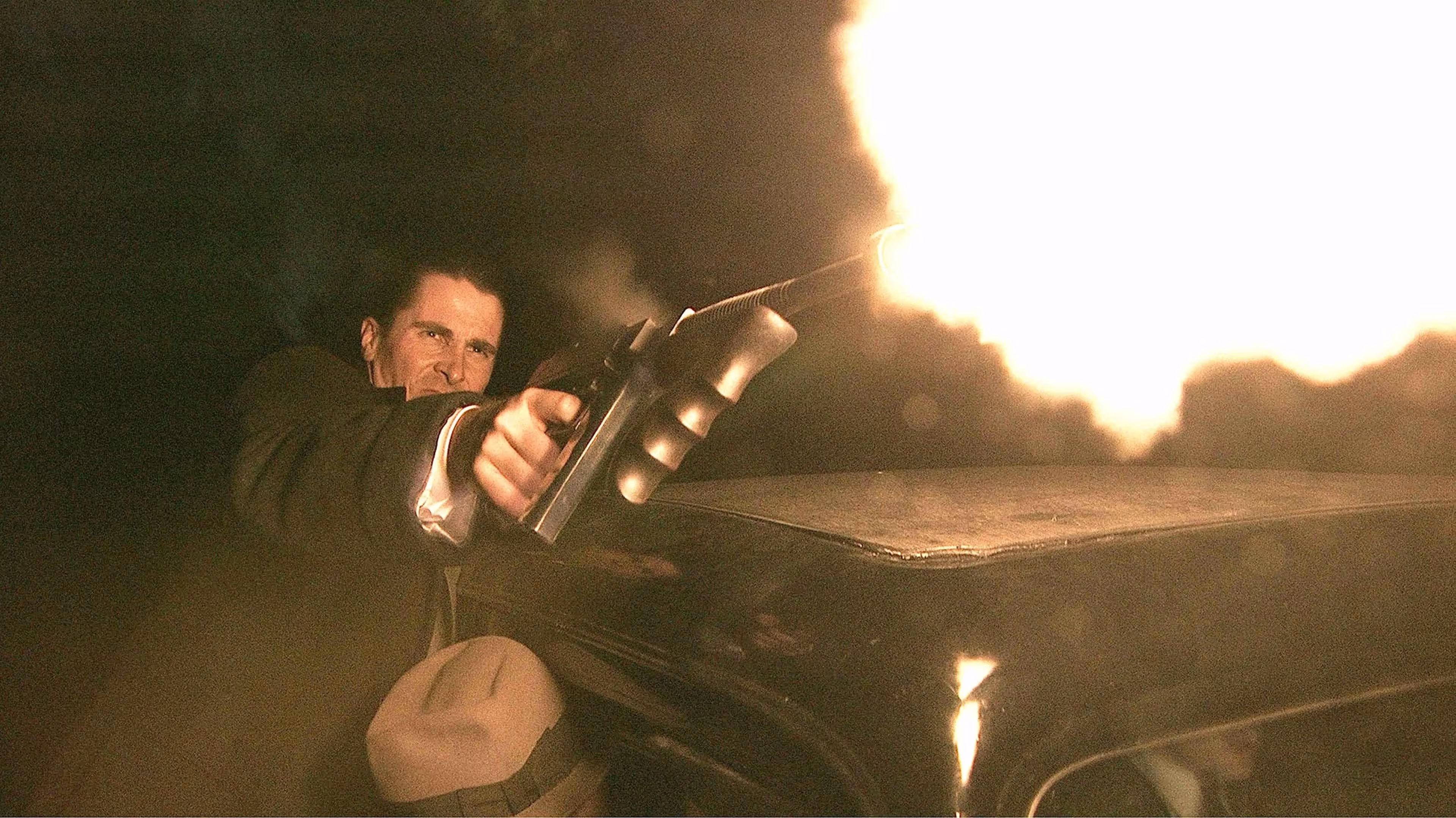 Christian Bale wearing Cartier Tank Chinoise in Public Enemies